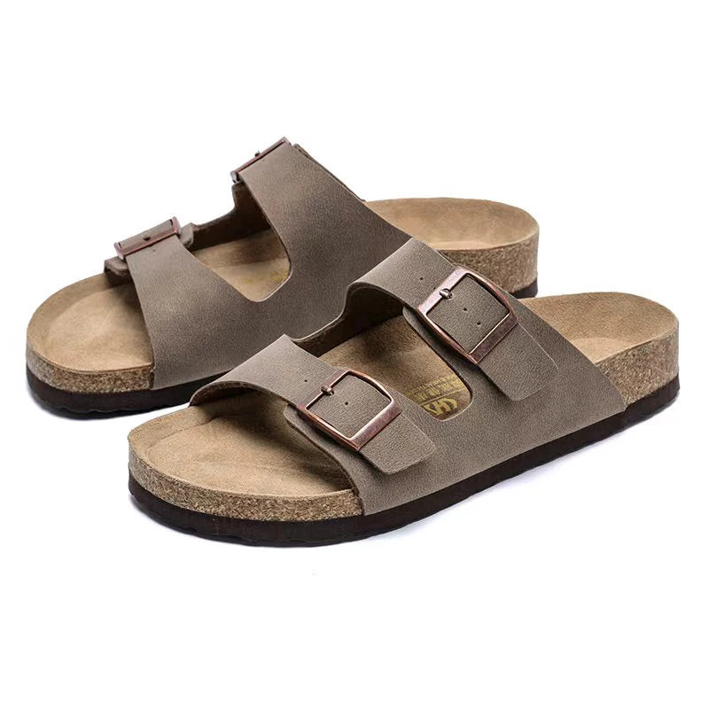 Premium cork footbed slide sandals with adjustable buckles — sophisticated summer comfort for men and women. Supportive, breathable, and versatile for beach, vacation, and casual wear.